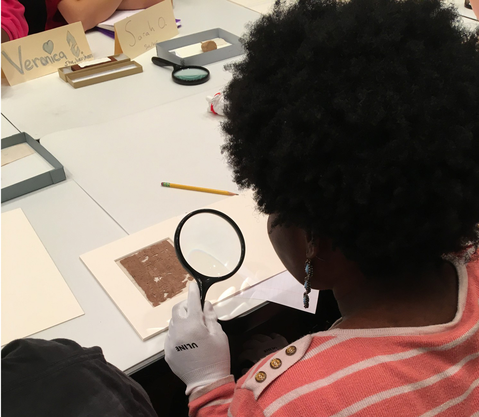 Students examine early coinage and manuscripts