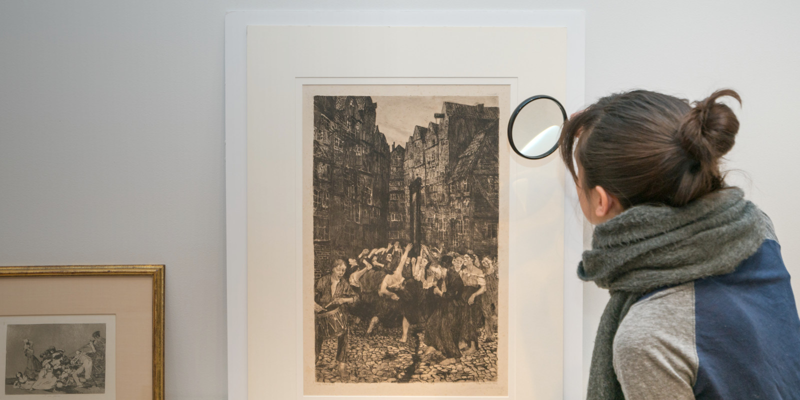 Student examining a print, Spring 2018 Student examining a print, Spring 2018