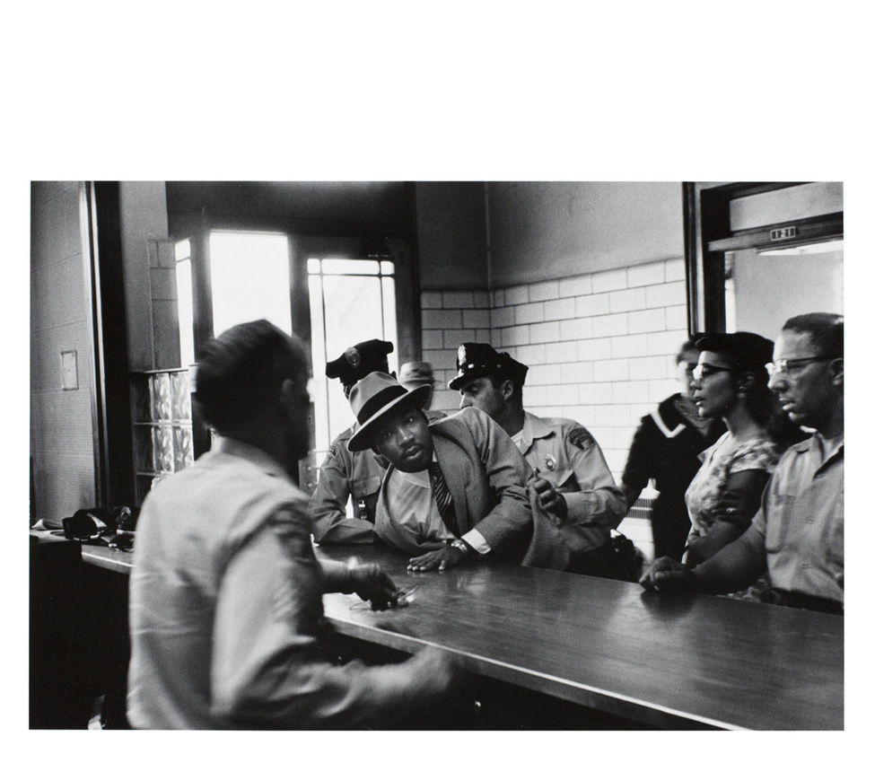 Charles Moore (American, 1931-2010), 	Dr. Martin Luther King, Jr. is arrested for loitering outside a courtroom where his friend and associate Ralph Abernathy is appearing for a trial, from Pictures That Made a Difference: The Civil Rights Movement, 1958 
