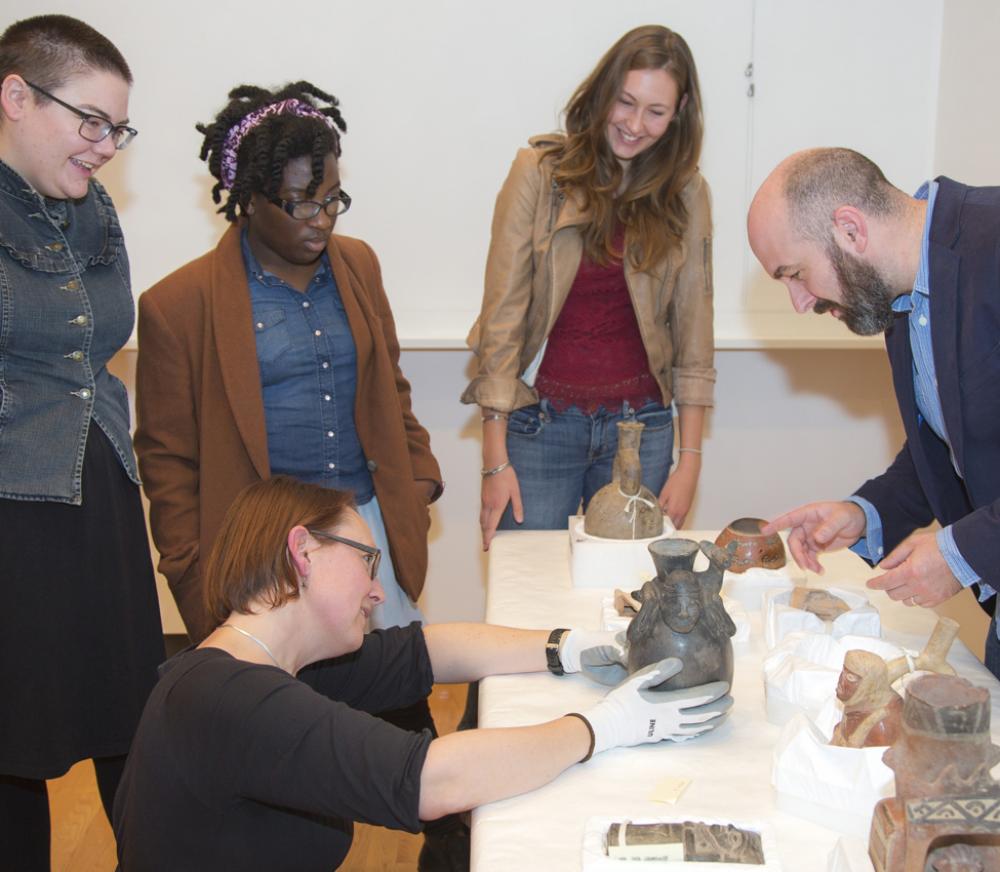 Five College Assistant Professor of Anthropology Elizabeth Klarich and students examine ancient Peruvian vessels Five College Assistant Professor of Anthropology Elizabeth Klarich and students examine ancient Peruvian vessels