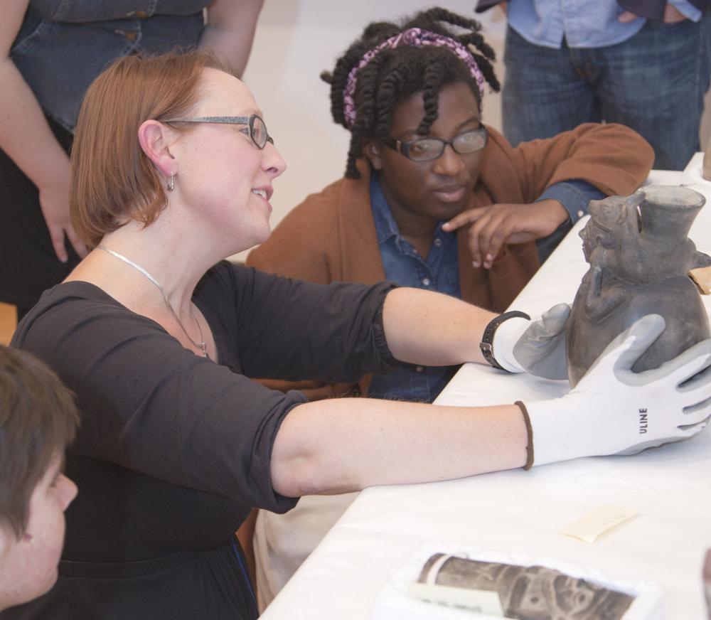 Professor Elizabeth Klarich and students in "Collecting the Past: Art and Artifacts of the Ancient Americas" get up close to a Peruvian vessel. Professor Elizabeth Klarich and students in "Collecting the Past: Art and Artifacts of the Ancient Americas" get up close to a Peruvian vessel.