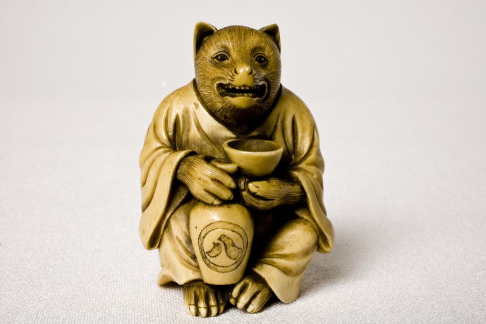 Japanese, Badger with saké cup and jar Japanese, Badger with saké cup and jar