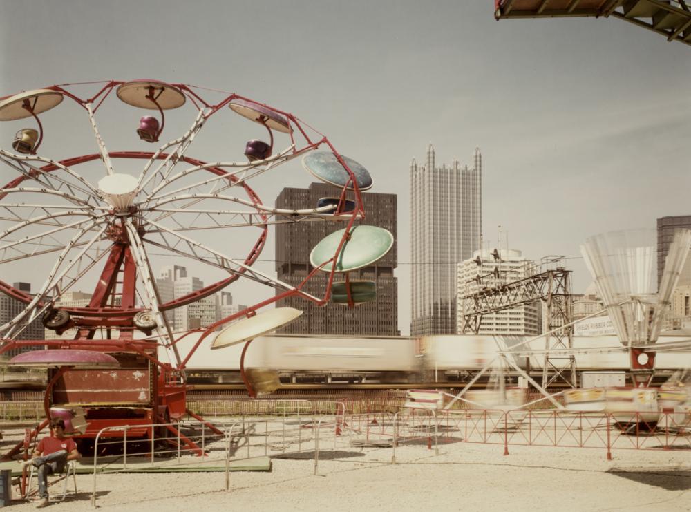 Joel Meyerowitz (American, b. 1946), Pittsburgh, Carnival and train (detail), 1984