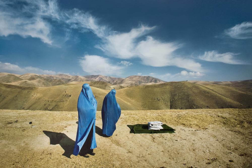 Lynsey Addario (American, b. 1973), Two Burqas: November 14, 2009. Nazer Begam and her pregnant daughter, Noor Nisa, 20, wait for transport to hospital after their car broke down in Badakshan, Afghanistan (#1 from the series Veiled Rebellion), 2009/2015