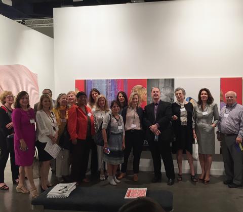 The MHCAM Friends of Art group with Museum director John Stomberg and gallerist Elizabeth Dee (fifth from right) at Art Basel Miami Beach, December 2015. In the background is a painting by New York-based artist Julia Wachtel.