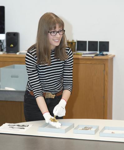 Curatorial Intern Madeline Ketley '17 demonstrates the functions of a 16th-century German pomander in the Carson Teaching Gallery.