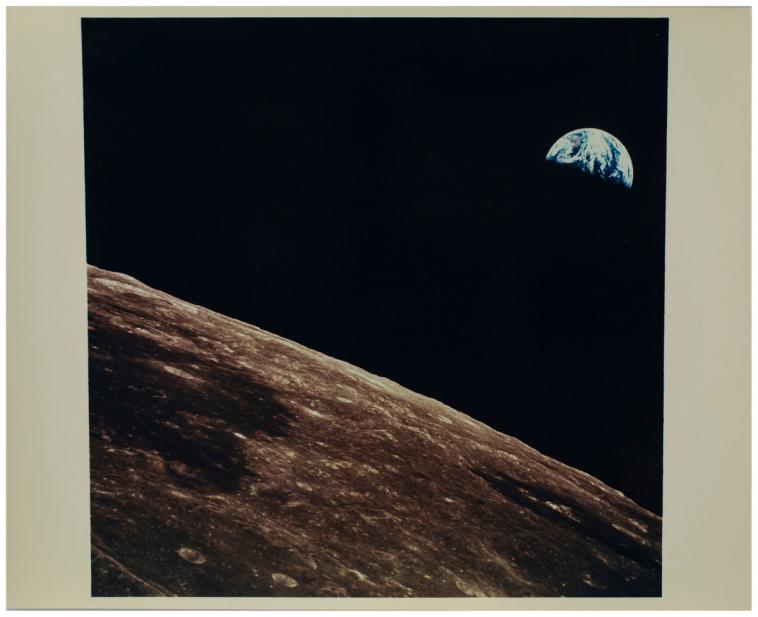 National Aeronautics and Space Administration (American), [Image of the earth taken from the moon with section of the moon and earth visible], 1969 July