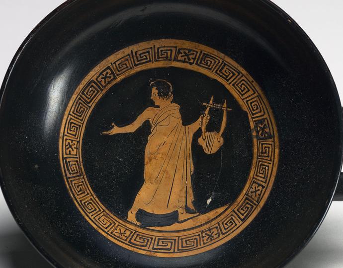 Greek, kylix showing a youth with lyre