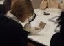 Students examine various forms of money from the Art Museum and Skinner Museum collections