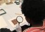 Students examine early coinage and manuscripts