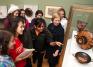 Professor Bettina Bergmann and art history students tour the exhibition Wine and Spirits: Rituals, Remedies, and Revelry