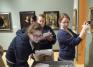 Chemistry students using infrared technology to look beneath a painting's surface