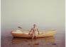 Joel Meyerowitz (American, b. 1946), Paul Theroux and his boat, 1983