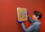 Preparator Ethel Poindexter with a fresco, March 2024