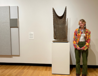Photo of Madigan Breiding ’26 in front of Untitled by Michelle Grabner