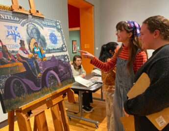 Students in History of Money, Spring 2024, Professor of History Desmond Fitz-Gibbon and students , Students examine various forms of money from the Art Museum and Skinner Museum collections