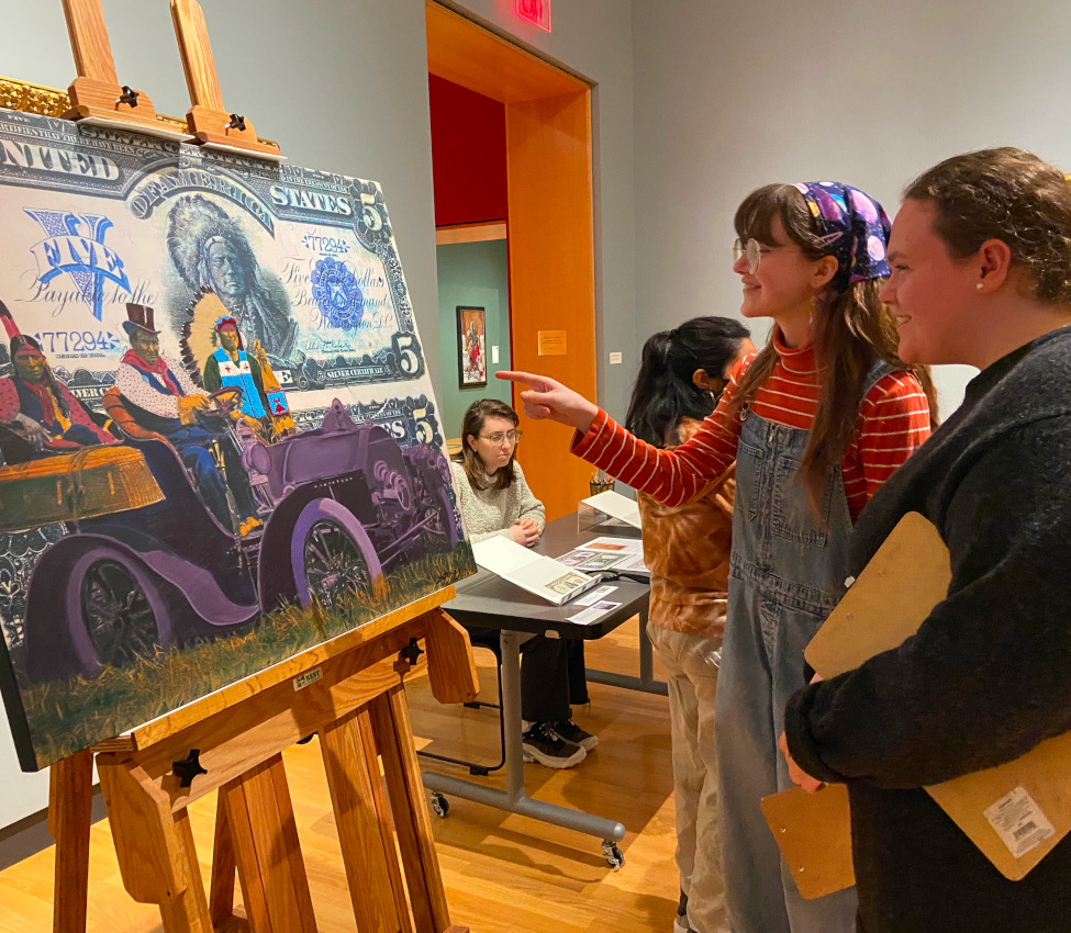 Students in History of Money, Spring 2024, Professor of History Desmond Fitz-Gibbon and students , Students examine various forms of money from the Art Museum and Skinner Museum collections