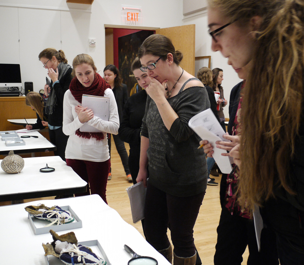 Place and Power in the American West and Pacific World, Examples of material culture provide students with a window into early American and indigenous histories, Assistant Curator Aaron Miller shows students a silver vessel, History students use a magnifying glass to get a closer look