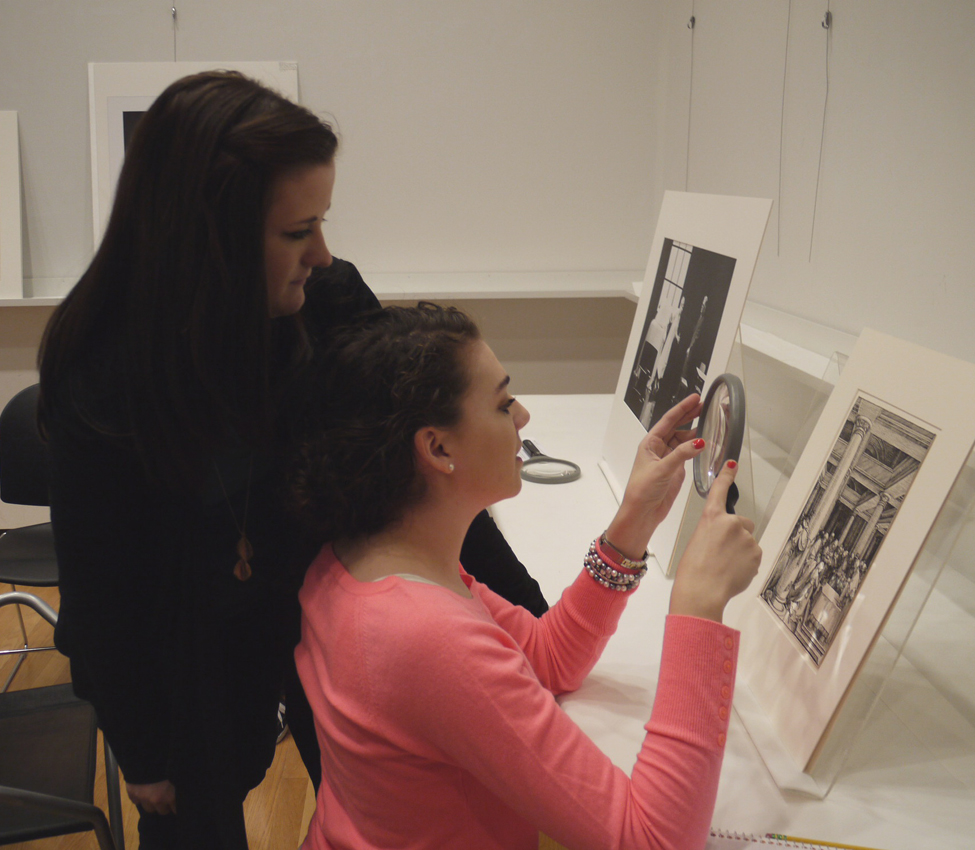 Film Studies students work collaboratively to compare and contrast images according to formal artistic elements, Film Studies students discuss the formal elements of artwork in preparation for analyzing film via its structural and visual components, Film Studies Professor Amy Rodgers guides her students through a visual examination of a work of art
