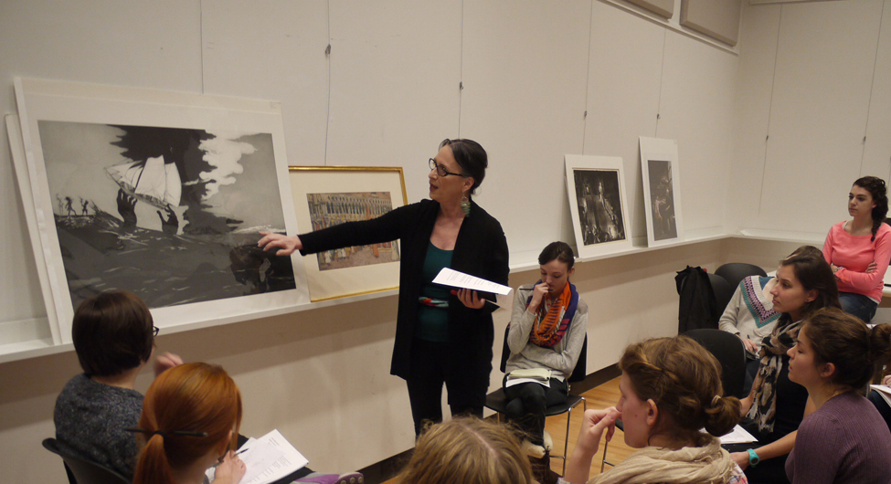 Film Studies students work collaboratively to compare and contrast images according to formal artistic elements, Film Studies students discuss the formal elements of artwork in preparation for analyzing film via its structural and visual components, Film Studies Professor Amy Rodgers guides her students through a visual examination of a work of art