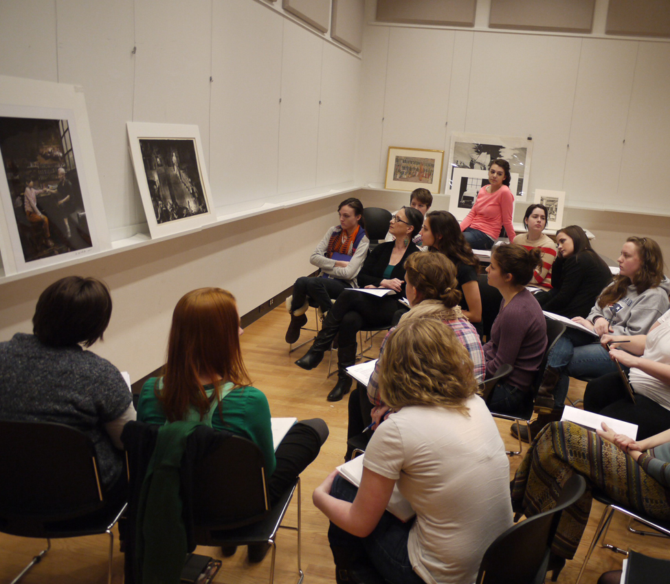 Film Studies students work collaboratively to compare and contrast images according to formal artistic elements, Film Studies students discuss the formal elements of artwork in preparation for analyzing film via its structural and visual components, Film Studies Professor Amy Rodgers guides her students through a visual examination of a work of art