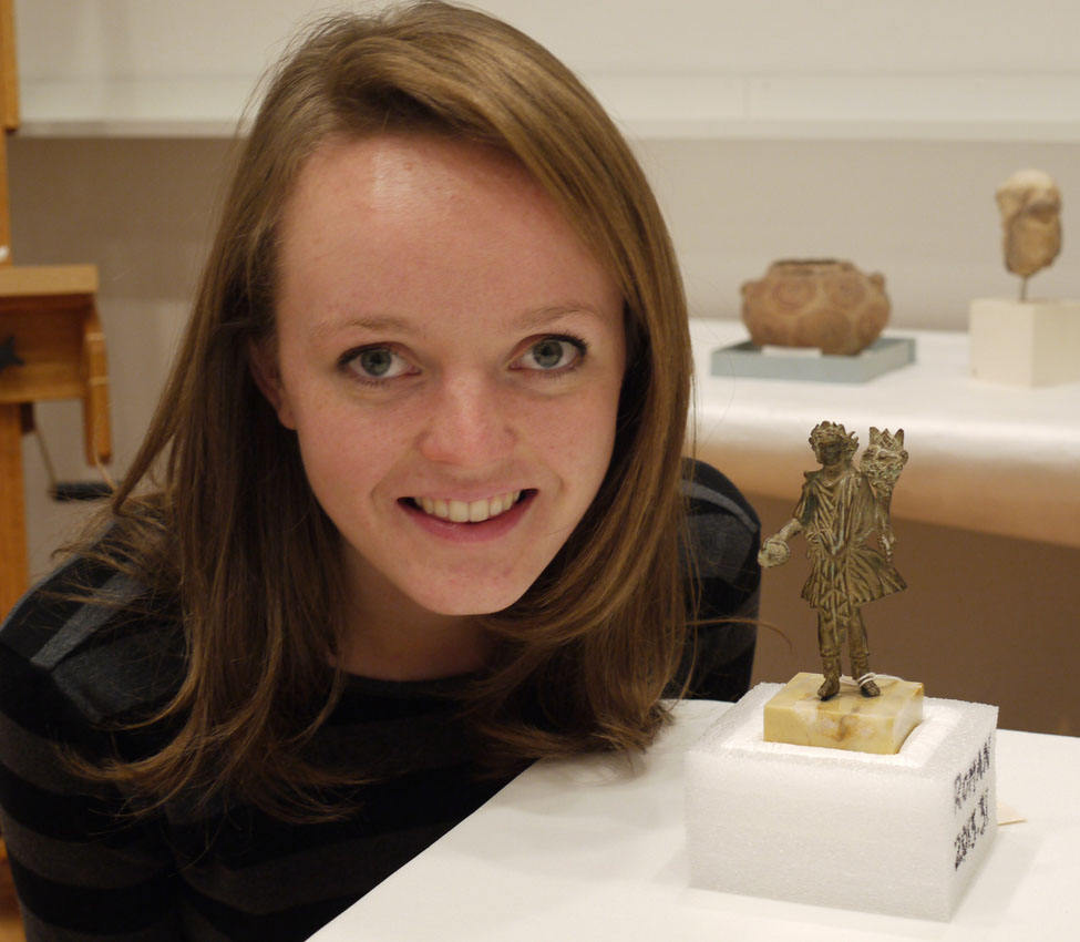 Taylor Anderson '15 with the Roman Lar she researched, Maker Unknown (Roman; Imperial), Lar holding a patera and cornucopia, 1st-2nd century CE, Screenshot of student Taylor Anderson's virtual exhibition