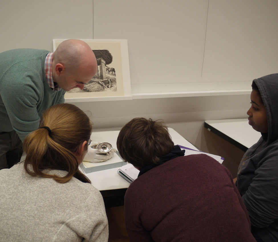 Place and Power in the American West and Pacific World, Examples of material culture provide students with a window into early American and indigenous histories, Assistant Curator Aaron Miller shows students a silver vessel, History students use a magnifying glass to get a closer look