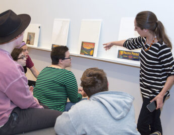 Place and Power in the American West and Pacific World, Examples of material culture provide students with a window into early American and indigenous histories, Assistant Curator Aaron Miller shows students a silver vessel, History students use a magnifying glass to get a closer look