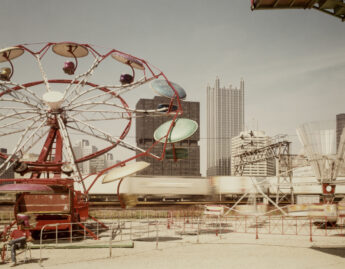 Joel Meyerowitz (American, b. 1946), Pittsburgh, Carnival and train (detail), 1984