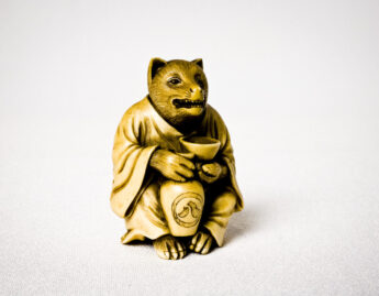 Japanese, Badger with saké cup and jar