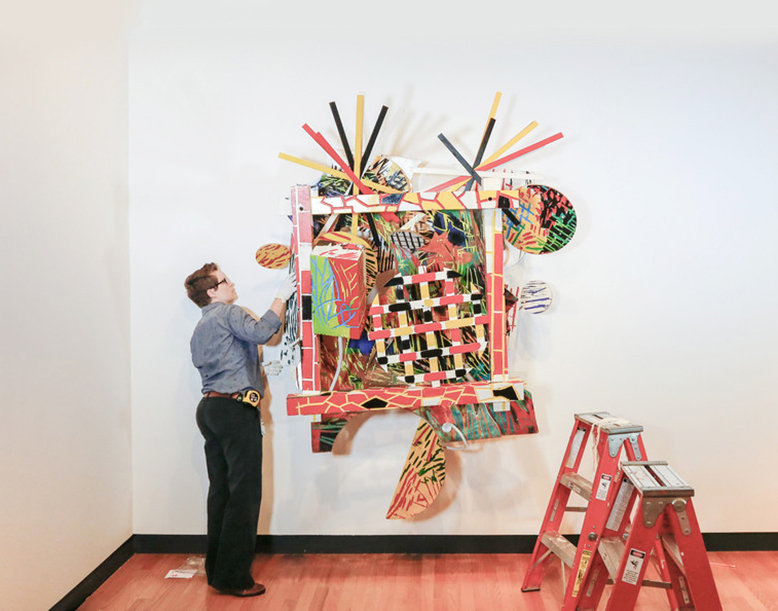 Bob Riddle, Jacqueline Finnegan, and Linda Best install a Judy Pfaff sculpture, Bob Riddle, Jacqueline Finnegan, and Linda Best install a Judy Pfaff sculpture, Jacqueline Finnegan installs a Judy Pfaff sculpture, Jacqueline Finnegan installs a Judy Pfaff sculpture, Bob Riddle, Jacqueline Finnegan, and Linda Best take a bow after completing the installation of a Judy Pfaff sculpture