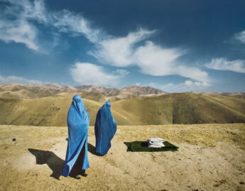 Lynsey Addario (American, b. 1973), Two Burqas: November 14, 2009. Nazer Begam and her pregnant daughter, Noor Nisa, 20, wait for transport to hospital after their car broke down in Badakshan, Afghanistan (#1 from the series Veiled Rebellion), 2009/2015