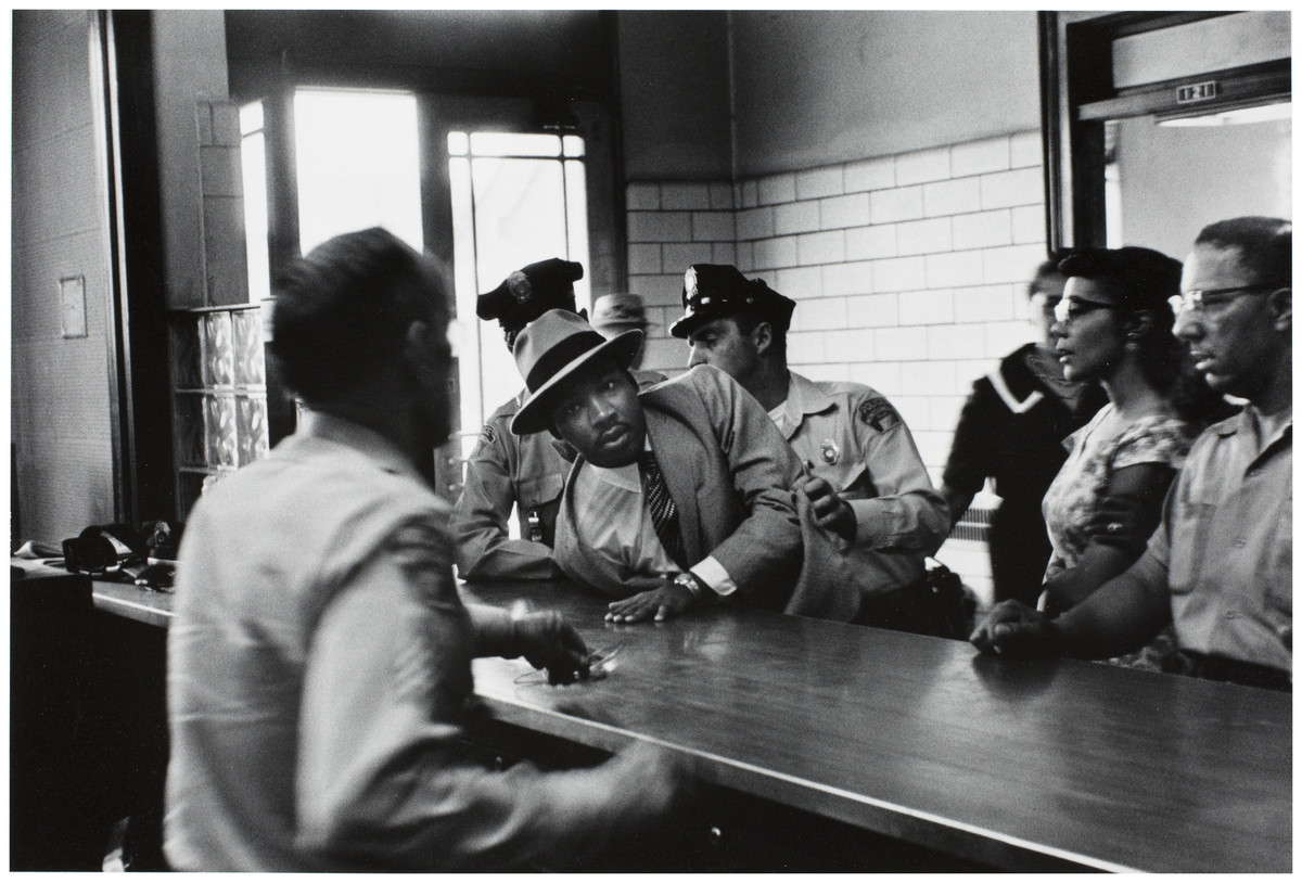 Charles Moore (American, 1931-2010), Dr. Martin Luther King, Jr. is arrested for loitering outside a courtroom where his friend and associate Ralph Abernathy is appearing for a trial, from Pictures That Made a Difference: The Civil Rights Movement, 1958