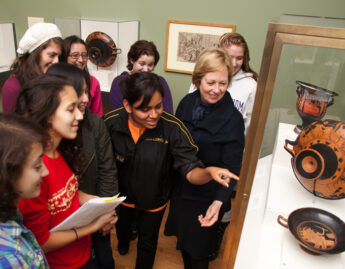 Professor Bettina Bergmann and art history students tour the exhibition Wine and Spirits: Rituals, Remedies, and Revelry
